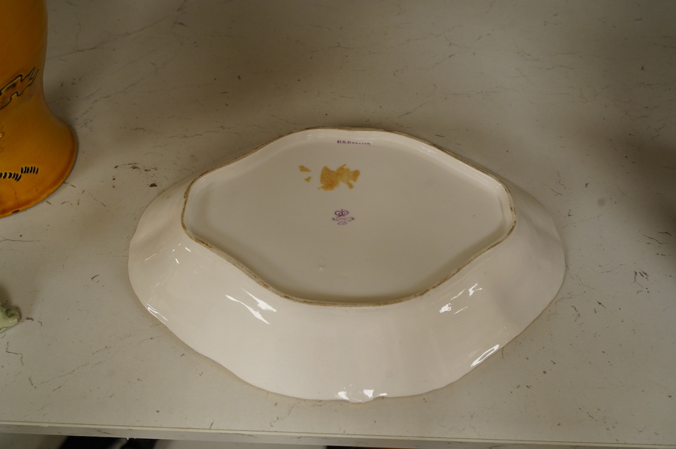 A Crown Derby gold Aves dessert dish with raised design, 28cm wide. Condition - fair to good, some wear to surface